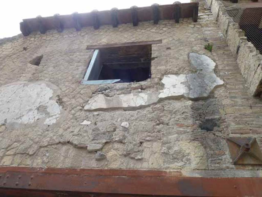 V 19, Herculaneum. May 2010. Upper floor with window above 3rd entrance, looking south.